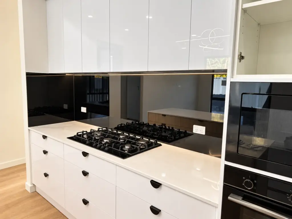 Coloured glass splashback in a kitchen
